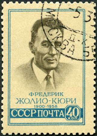 USSR - CIRCA 1959: A stamp printed in USSR shows portrait of Jean Frederick Joliot Curie (1900-1958), circa 1959のeditorial素材
