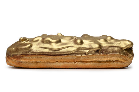 French golden eclair on white background