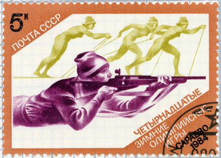 MOSCOW, RUSSIA - APRIL 18, 2023: A stamp printed in USSR shows Biathlon, 1984 Winter Olympics, Sarajevo, 1984のeditorial素材