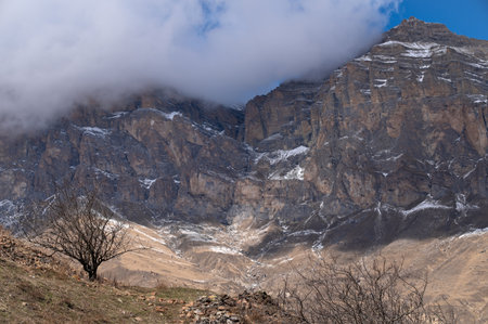 Landscape with rocky mountain against blue sky