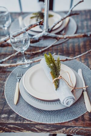 table set service with silverware and glass stemware at restaurantの写真素材