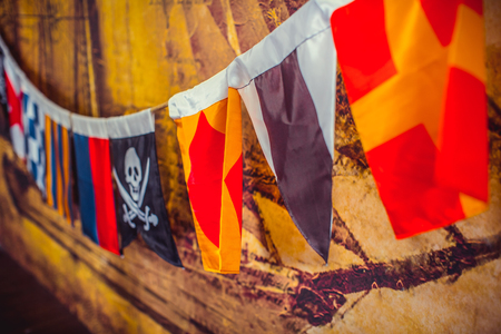 Sea flags with pirate hanging on the wallの写真素材