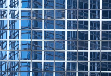 blue texture of light glass buildings in business center