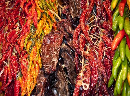 Lot of dried chili as a food background. Red dry Chili pepper background. Hot red chili pepper at market. Above pile of dried red chili pepper. Chili pepper background. Smoked red paprika. Dry paprikaの写真素材