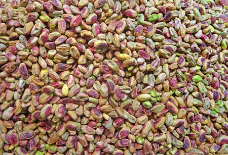 Green pistachio nuts without shell background