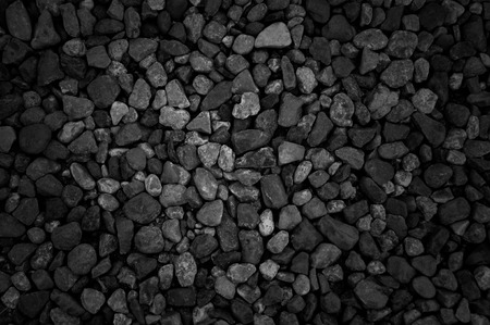 Black stones on a Black sand beach as a background. の写真素材