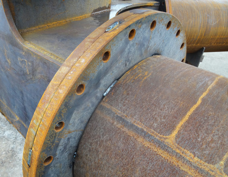 Outdoors industrial warehouse of finished steel pipes and metal products.の写真素材