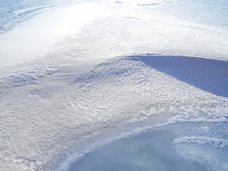 A Field covered with a snow in winter season. Winter countryside landscape.