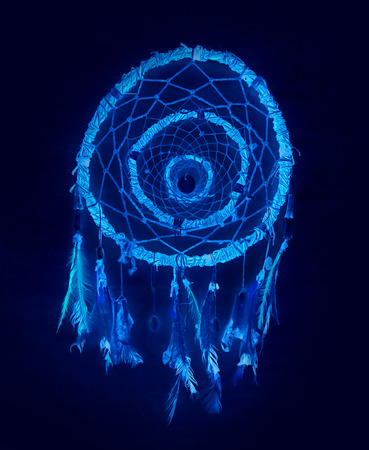 Dream catcher on dark background. Hunter of dreams in blue tones.の写真素材