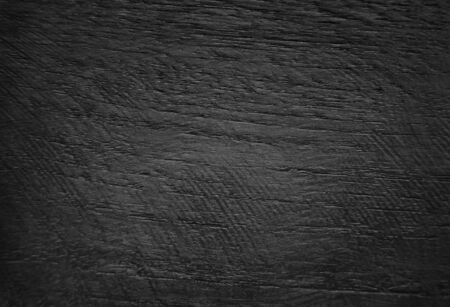 black wood texture background viewed from above. This surface would be great as design element.の写真素材