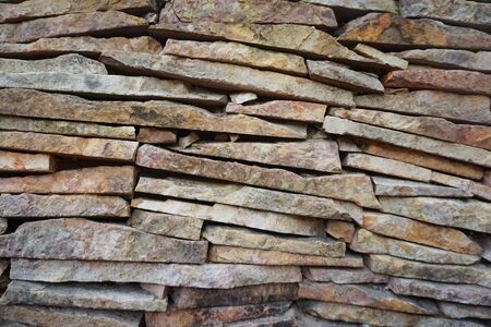 fragment of the restored wall of an old building made of stone  for design and background