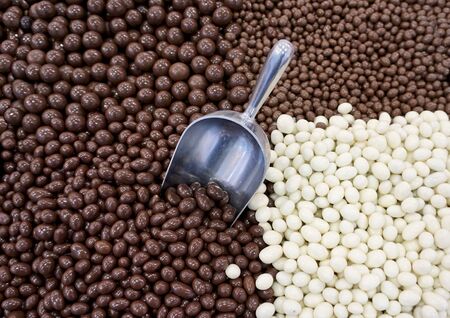 mix candy in white and dark chocolate, pastry food backgroundの写真素材