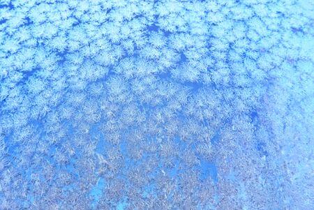 Winter frost in close up on a window