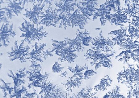 Frost ice patterns on winter window glass
