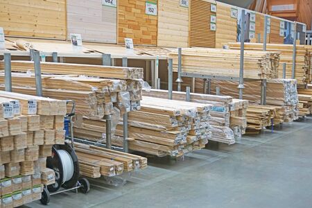 Piles of planks and timbers in a building materials store                               の写真素材
