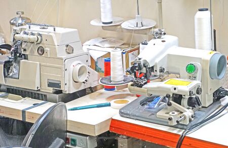 workplace seamstress with sewing machines                               