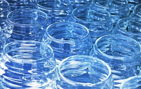 Many glass jar empty glasses row for jam or honey abstract background bokeh                         ...