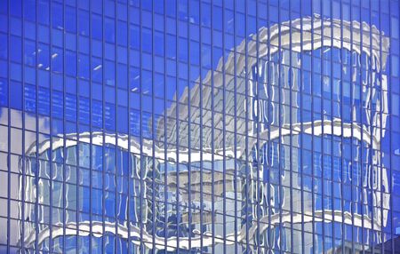 Reflection of the building in the glass facadeの写真素材