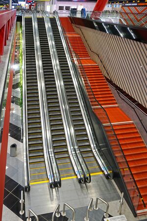 MOSCOW, RUSSIA - JANUARY 18, 2020: The interior of the airport. Escalator going up and down.