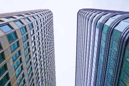 Modern office building with facade of glass on sky background.                                                              の写真素材
