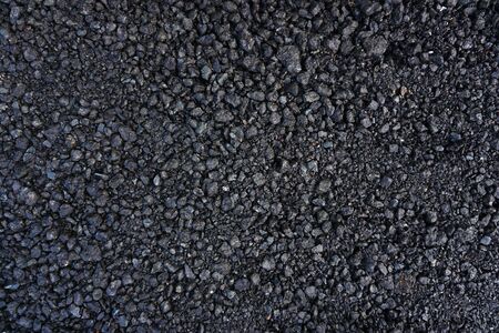 Black texture. Stone black wall. the cooled black lava. Rock texture. Stone background. . Stone texture. Rock pile background. Rough structure mineral                               の写真素材