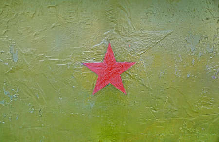 The red star on the green armor of military planeの写真素材