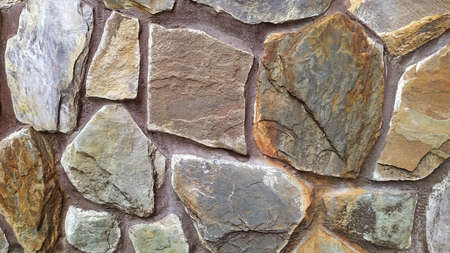 Light brown stone wall texture with shadows