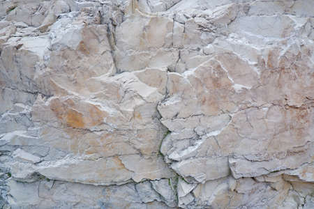 White rock wall. White background or texture.