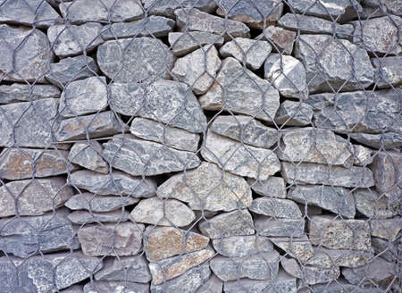Retaining wall gabion baskets, Gabion wall caged stones textured background