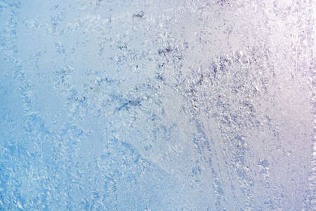 Frost ice patterns on winter window glass