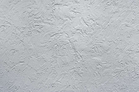 Textured white grunge background. light crumpled texture.の写真素材