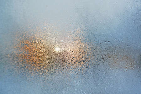 colorful dew drops on the glass, light backgroundの写真素材