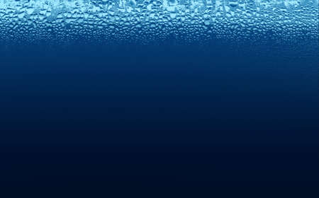 blue dew drops on the glass on white backgroundの写真素材