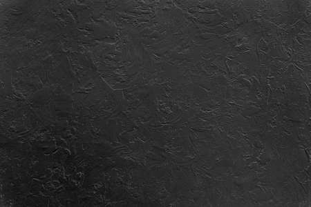 Textured black grunge background. Dark crumpled texture.の写真素材