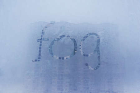 A silhouette in a thick fog during sunrise. urban defocus landscape.の写真素材