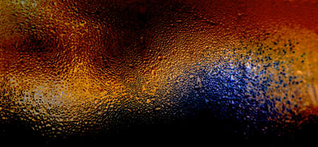 colorful dew drops on the glass, light backgroundの写真素材