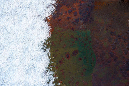 Snow on the rust metal surface background