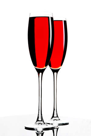 Two glasses with sparkling red wine, on a white background.の写真素材