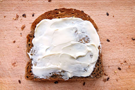 Sliced multigrain bread with cheese.の写真素材