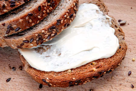 Sliced multigrain bread with cheese.の写真素材