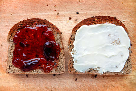 Sliced multigrain bread with jam.の写真素材