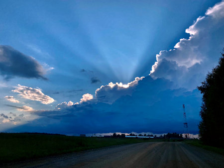 The rays of the evening setting sunの写真素材
