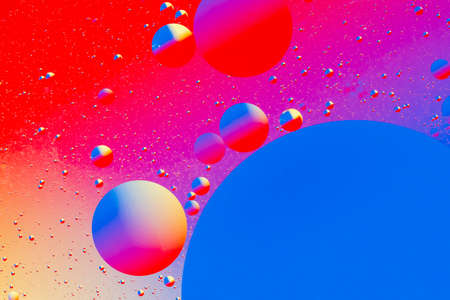 Abstract colorful background of oil circles. Oil in the water surface circles, water foam and oil bubbles.の写真素材