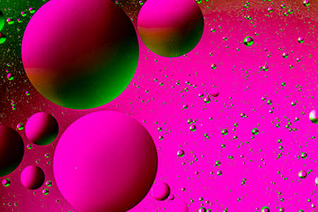 Abstract colorful background of oil circles. Oil in the water surface circles, water foam and oil bubbles.の写真素材
