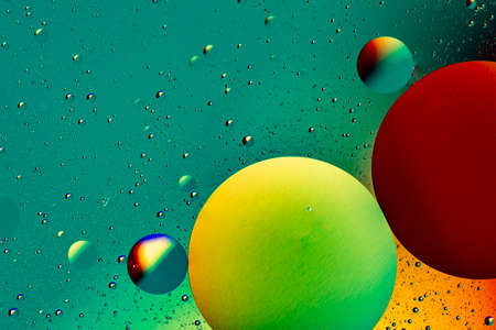 Abstract colorful background of oil circles. Oil in the water surface circles, water foam and oil bubbles.の写真素材