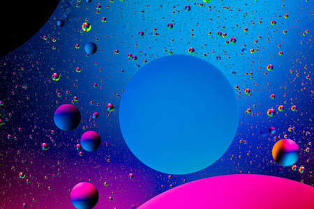 Abstract colorful background of oil circles. Oil in the water surface circles, water foam and oil bubbles.の写真素材