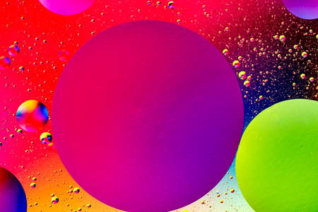 Abstract colorful background of oil circles. Oil in the water surface circles, water foam and oil bubbles. High quality photoの写真素材