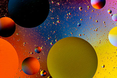 Abstract colorful background of oil circles. Oil in the water surface circles, water foam and oil...