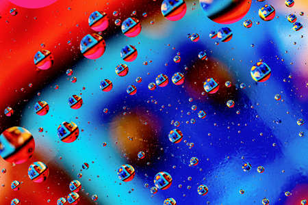 Abstract colorful background of oil circles. Oil in the water surface circles, water foam and oil bubbles. High quality photoの写真素材