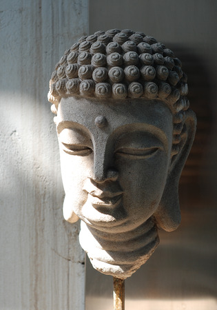 Ancient sand stone Buddha faceの写真素材